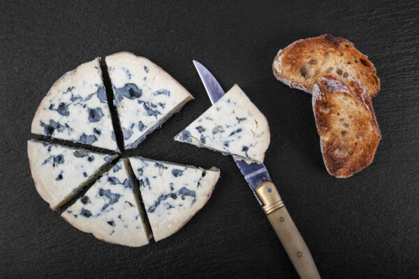 french cow's milk cheese called Fourme d'Ambert on a plate